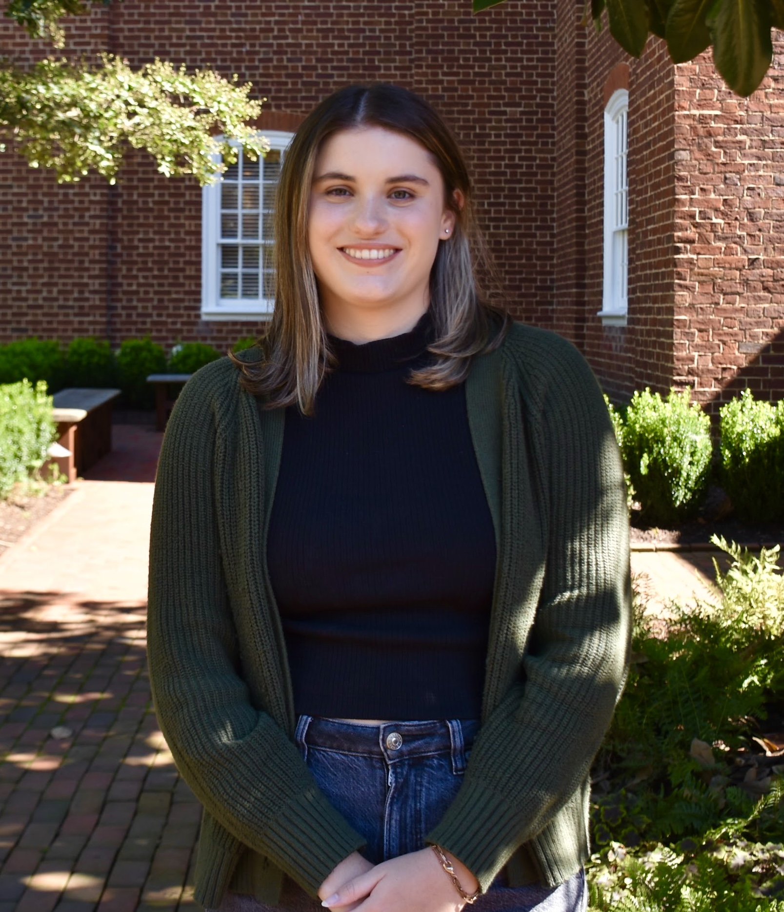 Headshot of Sabrina LaBold smiling in graduation regalia